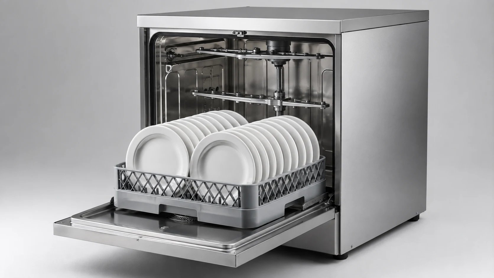 commercial undercounter dishwasher interior with rack spray arms and wash chamber